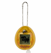 Load image into Gallery viewer, Jurassic Park 30th Anniversary Tamagotchi Dinosaur Amber Version