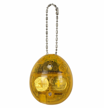 Load image into Gallery viewer, Jurassic Park 30th Anniversary Tamagotchi Dinosaur Amber Version
